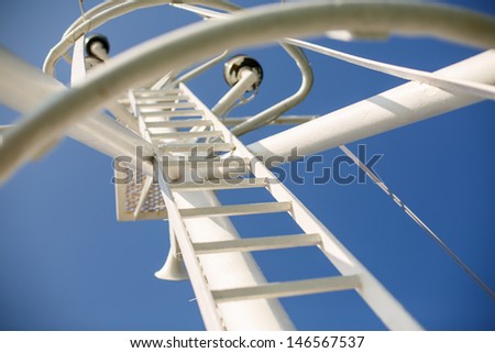 background. staircase on the ship. Gear old sailing ship on the background of an blue sky