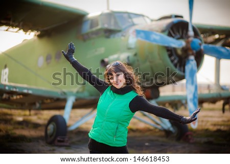 a love story. portrait of a young woman who dreams of traveling. exploring the world map. meeting at a retro airplane.