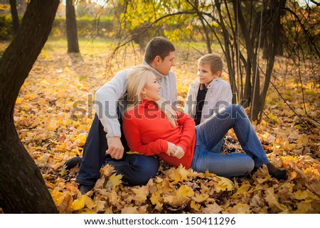 happy family in the autumn garden. family ties