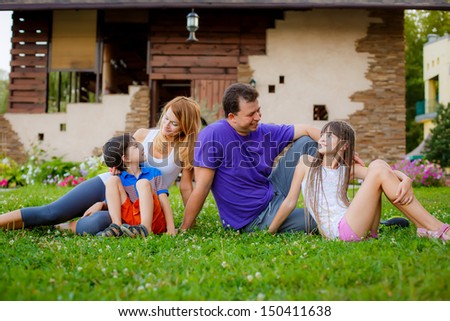 happy family in the garden. look at each other