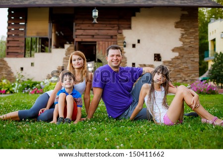 father, mother, son and daughter in the garden. sports family