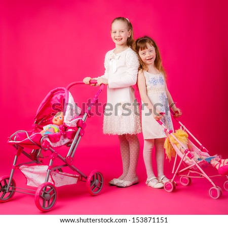 beautiful girls with dolls and toy strollers