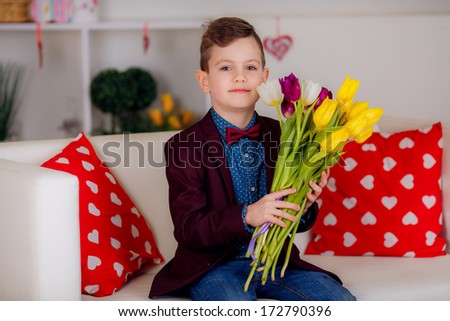 beautiful   little gentleman wearing a jacket, tulips, March 8, valentine\'s day, mother\'s day