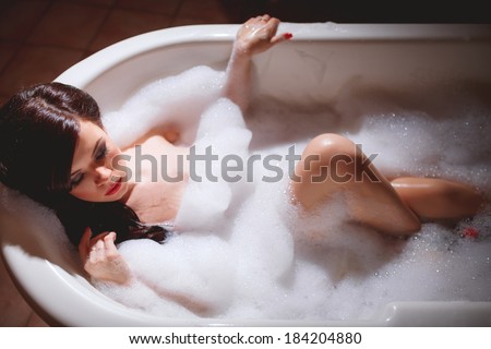 beautiful sexy girl takes a bath