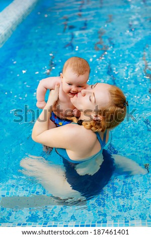 Happy mother with her son in the pool. prevention of diseases of the musculoskeletal system. Swimming lessons for children.