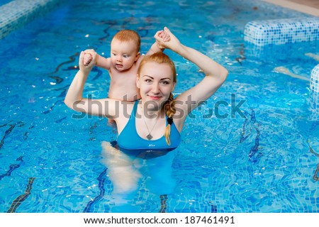 Happy mother with her son in the pool. prevention of diseases of the musculoskeletal system. Swimming lessons for children. health
