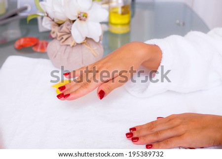 Beautiful girl in a beauty salon. manicure. spa treatments for hands. hand care. Beauty and Health