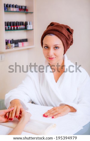 Beautiful girl in a beauty salon. manicure. spa treatments. skin care. Beauty and Health
