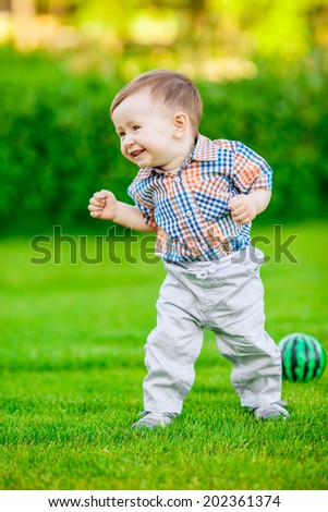 Adorable baby playing in the park. green, smile, emotion, summer