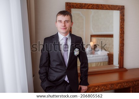 Portrait of the groom in the room