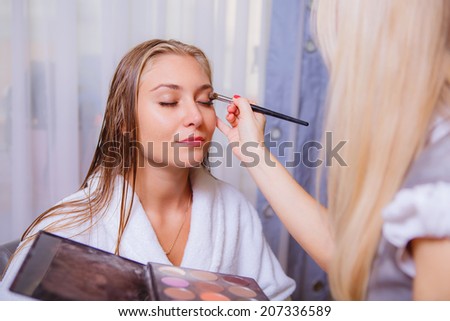 makeup artist doing makeup beautiful girl, beauty, health,   close-up