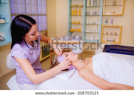 body treatments. beautiful girl receives cosmetic treatments in the beauty salon, health and beauty, body care