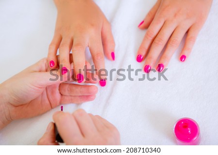manicure, girl doing manicure in beauty salon, close-up