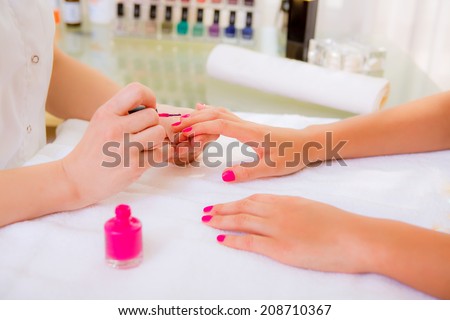manicure, girl doing manicure in beauty salon