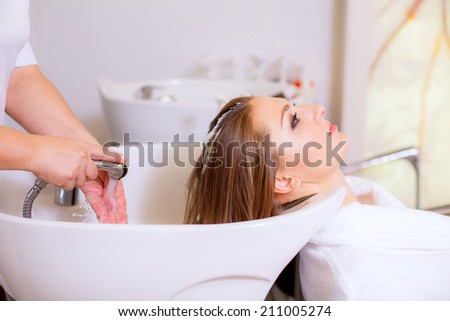 Hairdresser girl washing her hair, hair care, health   hair