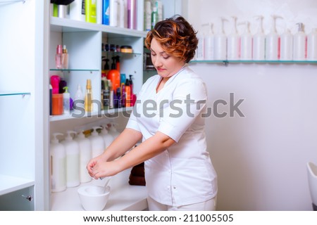 Hairdresser preparing hair mask, hair care, health and beauty hair