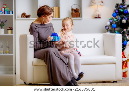 Christmas concept. happy mother and daughter in the room