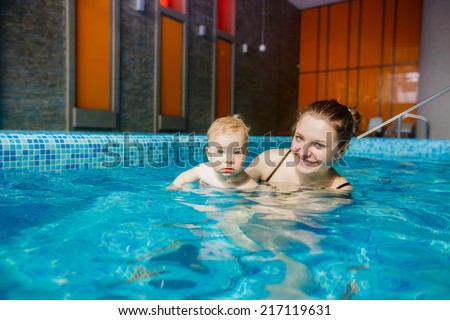 happy mother and son in the pool.  child development, disease prevention