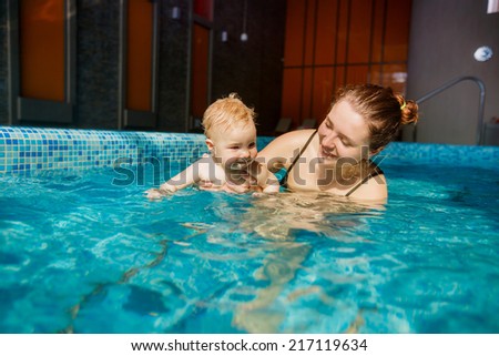 happy mother and son in the pool. playing sports. child development, disease prevention