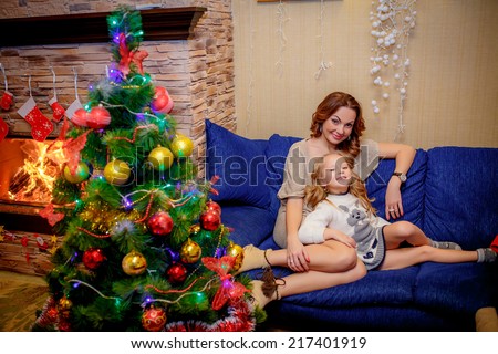 happy mother and daughter near a Christmas tree. Christmas holidays. Christmas decor. new year