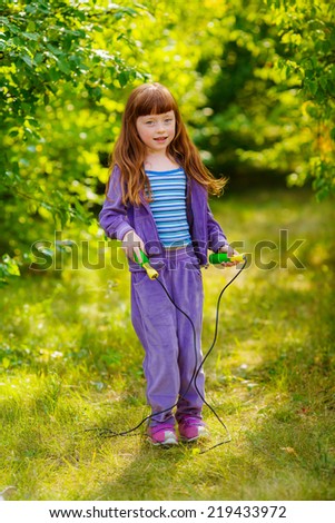 beautiful girl jumping on a skipping rope