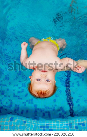 child in the pool. swimming for infants, disease prevention