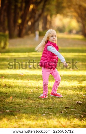 girl jumping in autumn park. active, to rest, to run