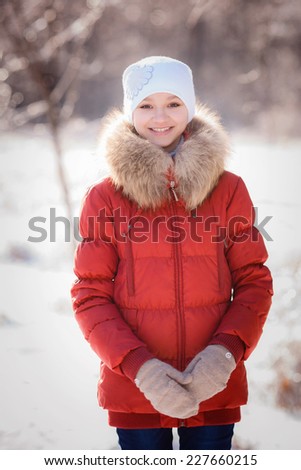 portrait of beautiful girl in winter forest. Christmas