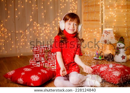 girl at home for Christmas, New Year`s decorations, illuminations