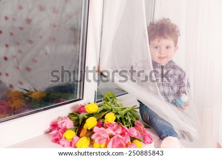 Happy boy with Yellow and pink tulips, March 8, Mother\'s Day, International Women\'s Day, Valentine\'s Day