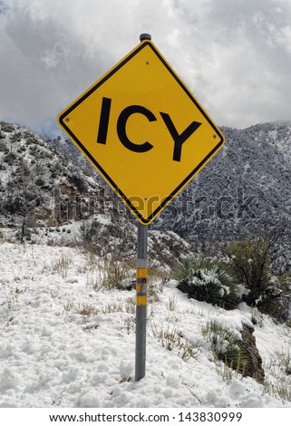 ICY - Road Sign. San Gabriel Mountains, Angeles National Forest, Los Angeles County, California, USA. Rare, low-altitude snowfall, late winter 2013.