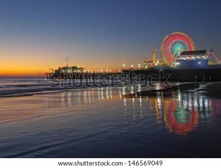 Old Ferris Wheel and Santa Monica Pier at Twilight. Santa Monica, California, USA.