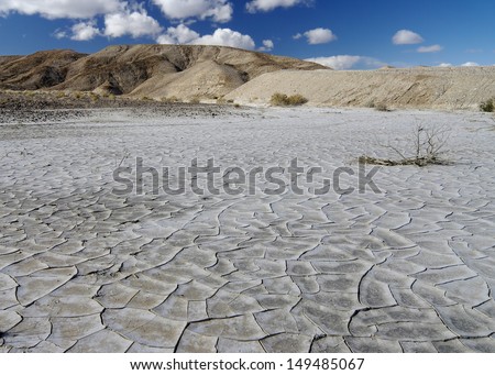 Dry and cracked desert ground  - desertscape. Location: Mojave Desert, Southern California, USA.