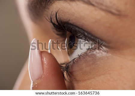 close-up view of the adjustment of contact lenses