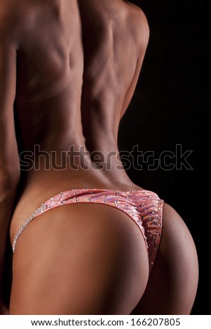 Toned female with muscles from rear - Stock Image - Everypixel