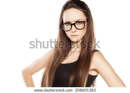 angry young woman with glasses on white background