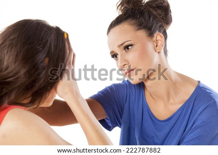 young woman consoling her crying friend