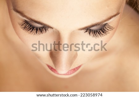 female face and eyes with false eyelashes