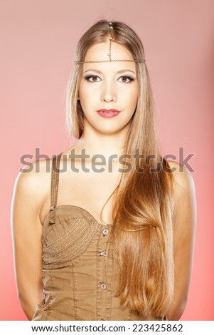 beautiful girl with long hair and a chain across her forehead
