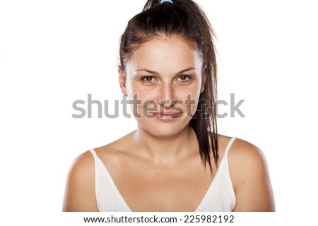 Natural young woman with a fake smile
