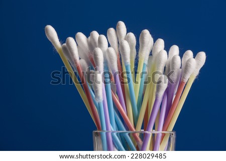 A pile of cotton swabs in different colors