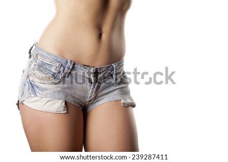 torso of young beautiful women in short jeans