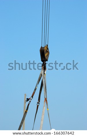 Working crane hook carry something with clear sky