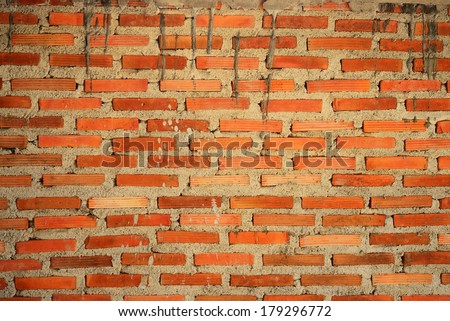 Orange brick wall build from concrete for background