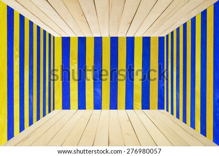 Wood room with blue and yellow striped wall and floor for background