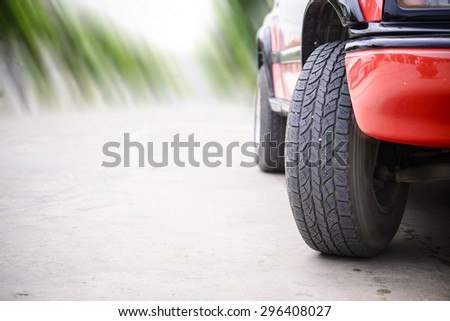 Car tire on the road with motion blur road background