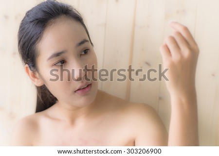 Woman see her hand while take a bath portrait