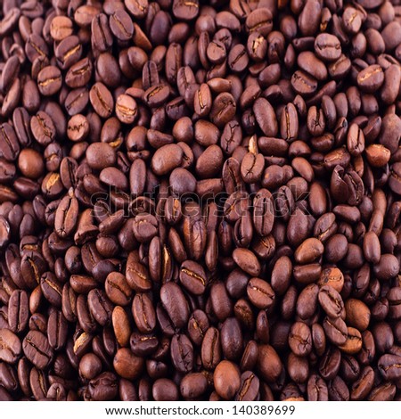 Coffee close-up brown beans texture background