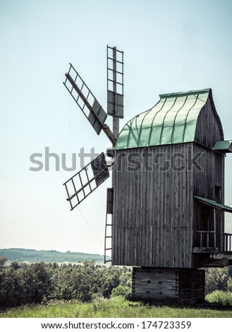 Wooden windmills old near the village in Folk Arts museum Pirogovo, Kiev, Ukraine
