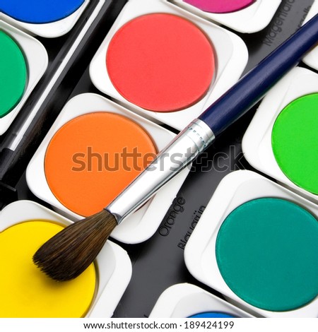 Watercolor paint brushes and paints color pallet